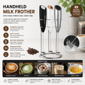 Handheld electric milk frother in black, white and silver